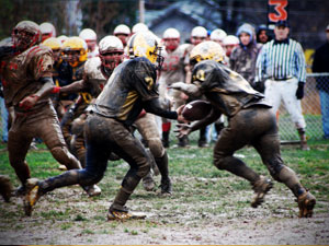 Muddy Football Players