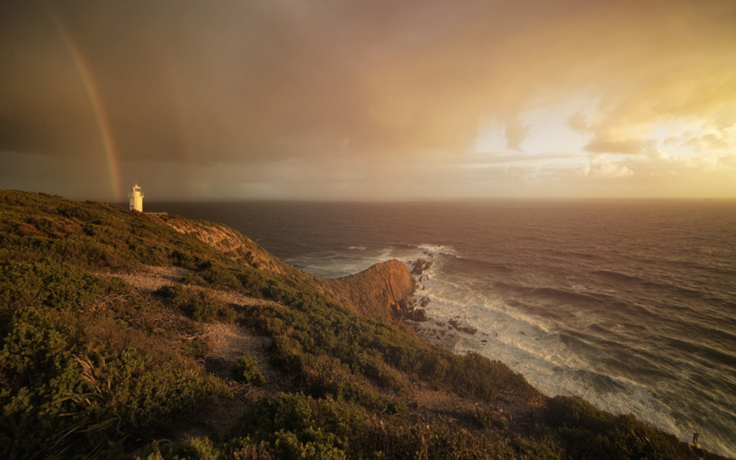 rainbows near lighthouse